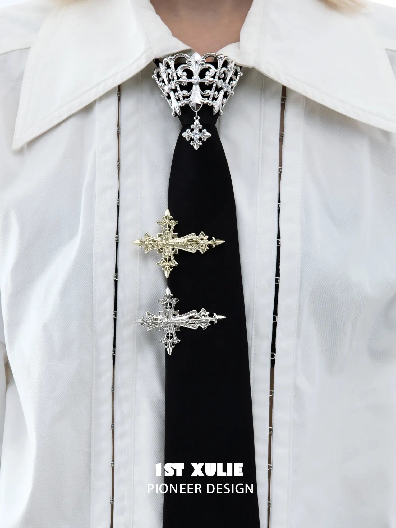 Fleur-de-Lis cross hair clips worn as tie clips; other accessories are styling props.