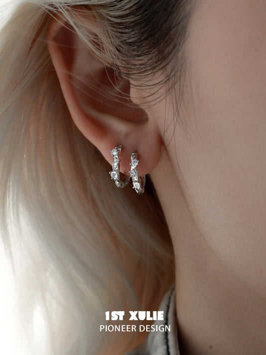 1ST XULIE "Star Trails" Möbius Twist Pavé Huggie Earrings in 925 Sterling Silver - On Model