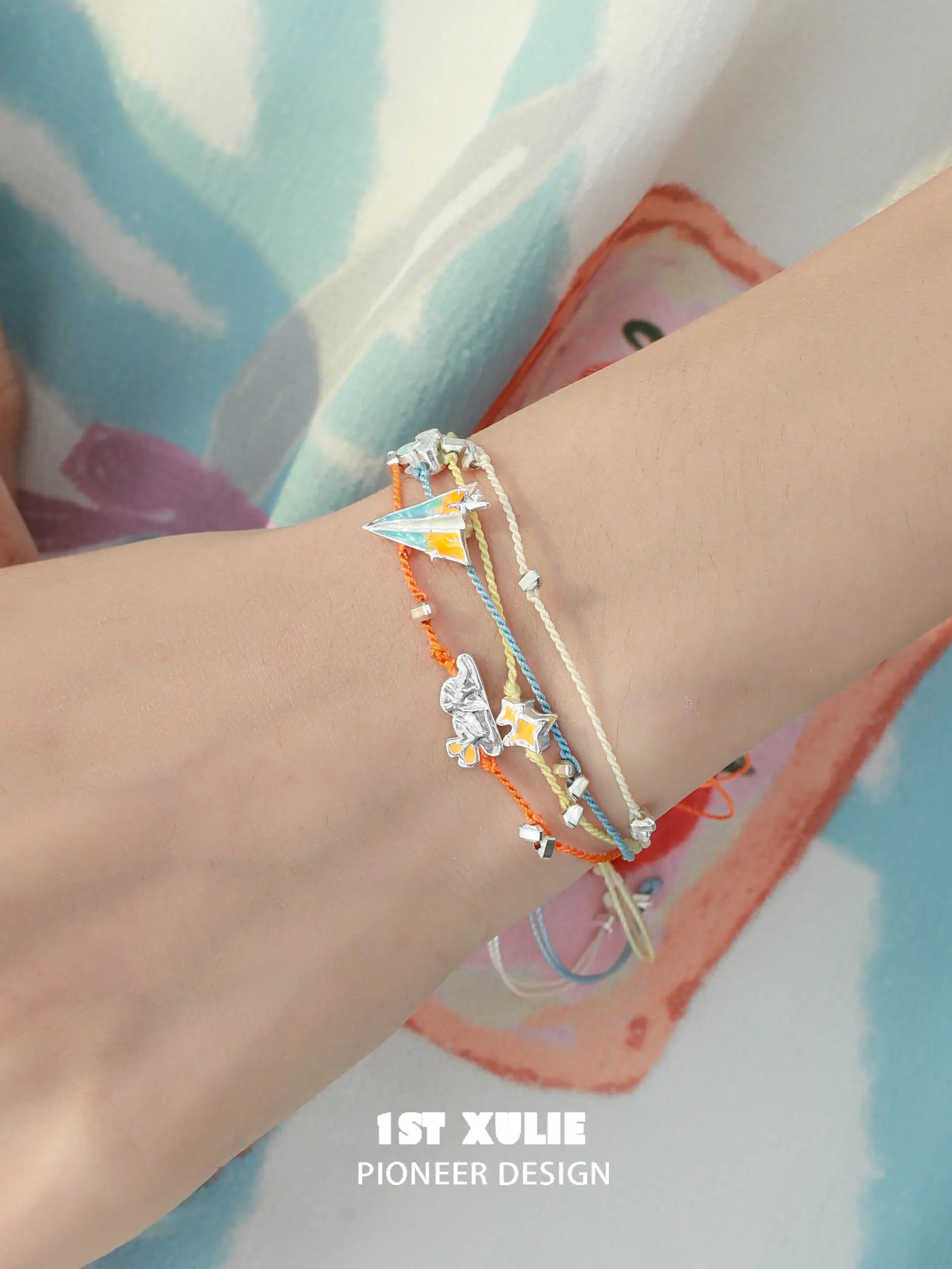 1ST XULIE Jewelry "Juicy Flight" Colorful Paper Plane Summer Friendship Charm Bracelet in Platinum Plated & Colorful Resin - On Model Close-up
