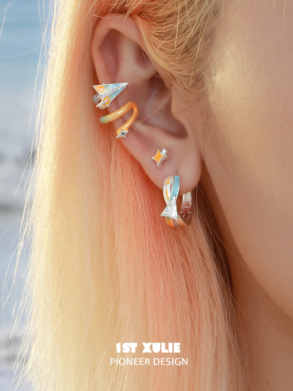 1ST XULIE "Juicy Flight" Asymmetrical Paper Plane & Star Mismatched Studs in 925 Sterling Silver - On Model Close Up