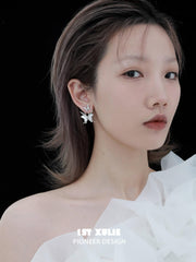 1ST XULIE "Whiterfly" Skeletal Shell Earrings in Platinum Plated 925 Silver - On Model