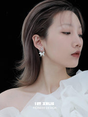 1ST XULIE "Whiterfly" Skeletal Shell Earrings in Platinum Plated 925 Silver - On Model Angled View