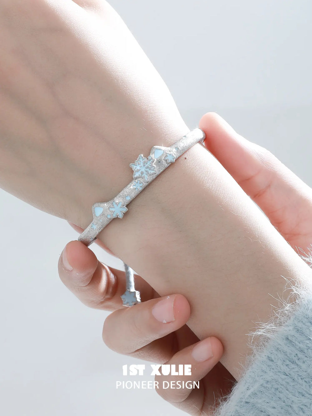 1ST XULIE Jewelry "Snow Land" Snowflake Cat Bell Bangle in Brass - Lifestyle Shot