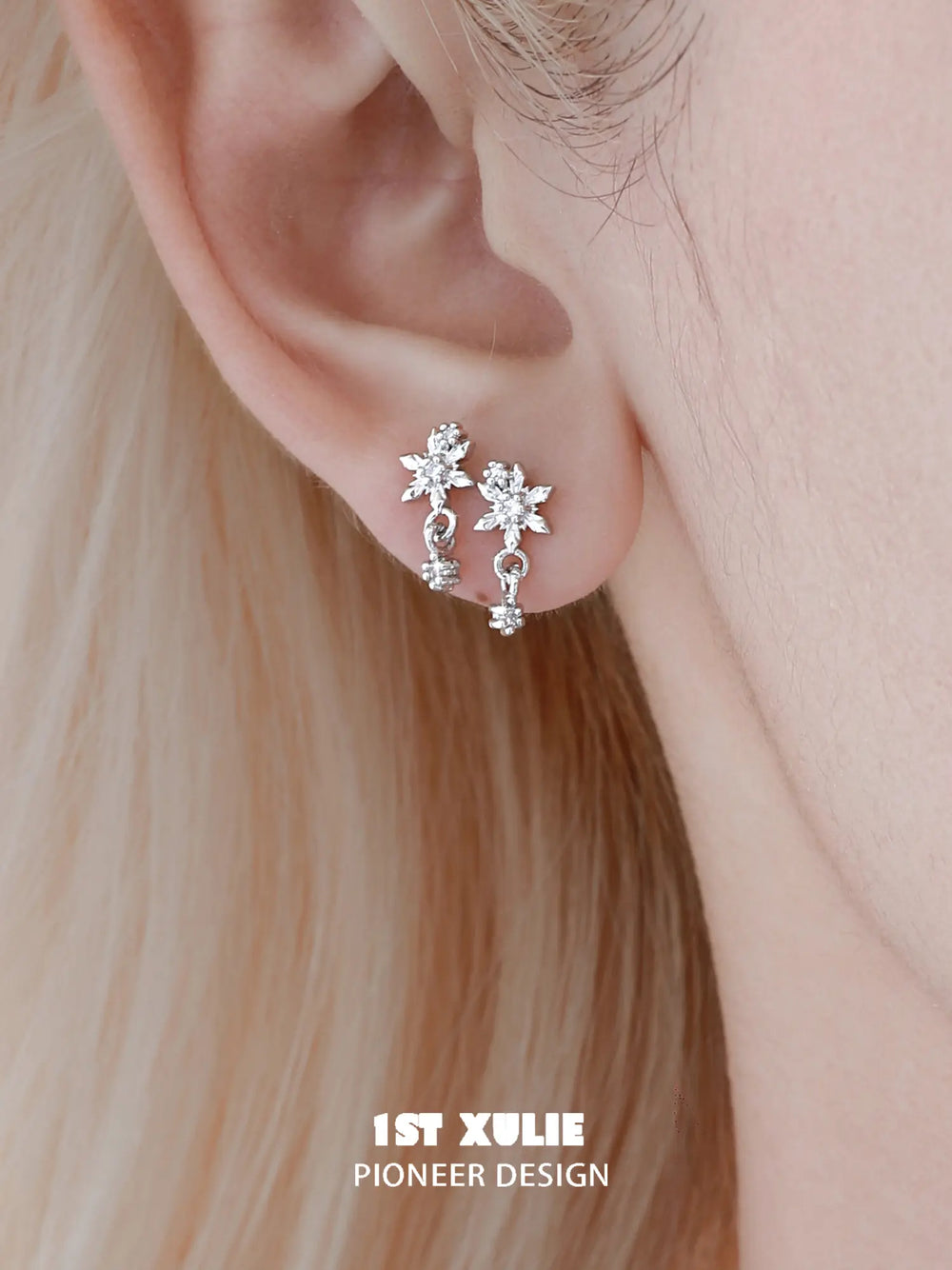 1ST XULIE Jewelry "Snow Land" Sparkling Snowflake Huggie & Stud Earrings in Platinum Plated - Angle View 1