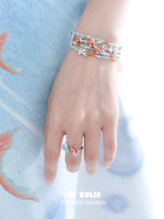 1ST XULIE Jewelry "THE SEA" Whimsical Goldfish Beaded Charm Bracelet in Brass - On Model Close Up