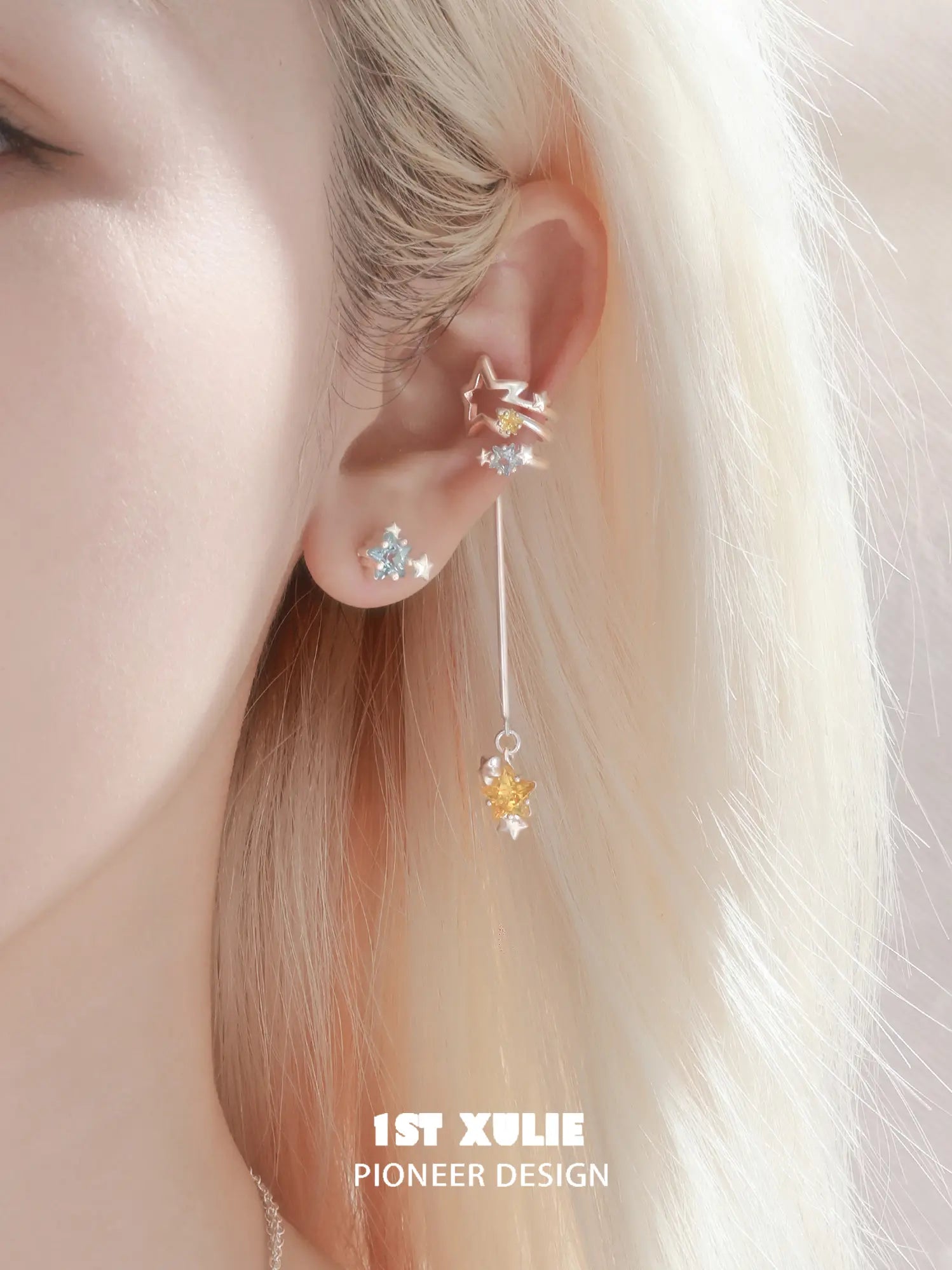 1ST XULIE Jewelry "WISHING STAR" Blue Zirconia Wishing Star Stud Earring in Rhodium Plated Brass - Detail Shot