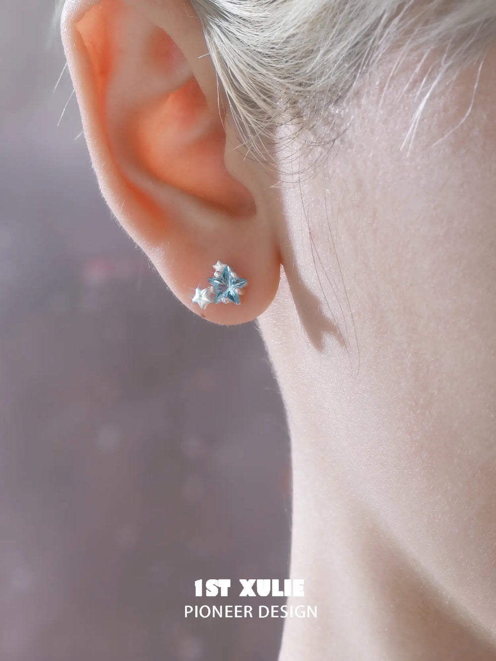 1ST XULIE Jewelry "WISHING STAR" Zirconia Wishing Star Stud Earrings in Rhodium Plated Brass - Lifestyle Shot