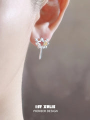 1ST XULIE Jewelry "WISHING STAR" Wishing Wand Zirconia Stud Earrings in Rhodium Plated - Lifestyle Shot