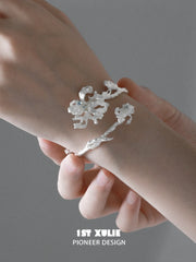 1ST XULIE Jewelry "Irises" Zirconia Iris Bangle in Rhodium Plated - Angle 1