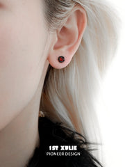 1ST XULIE "Black Swan" Asymmetrical Swan Wing Stud Earrings in Black Gold & Platinum Plated - Detail Shot