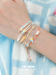 Juicy Flight Orange Sea Paper Plane Braided Rope Bracelet™