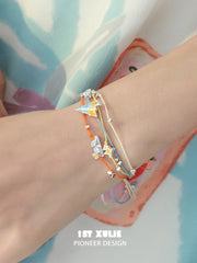 Juicy Flight Orange Sea Paper Plane Braided Rope Bracelet™