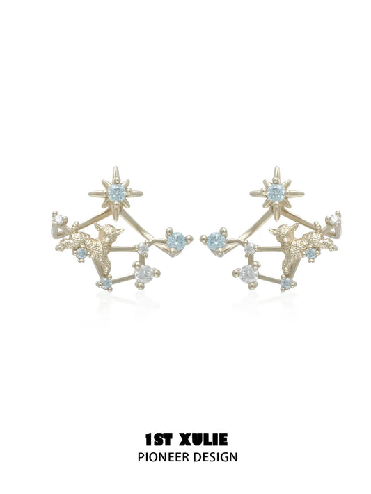 Gold-toned star earrings with detachable constellation-like lower sections
