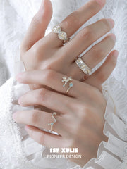 Ram and constellation open rings worn with coordinating jewelry