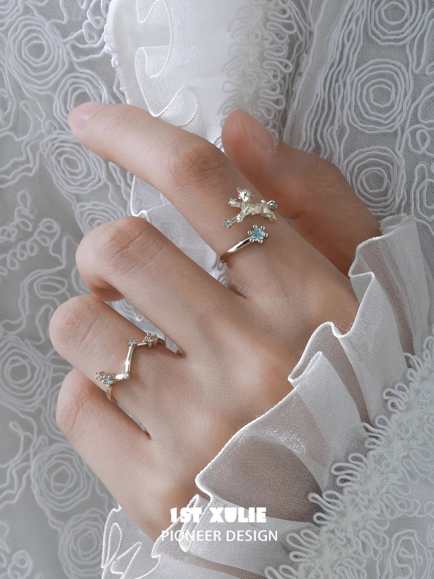 Ram and constellation open rings worn with coordinating jewelry