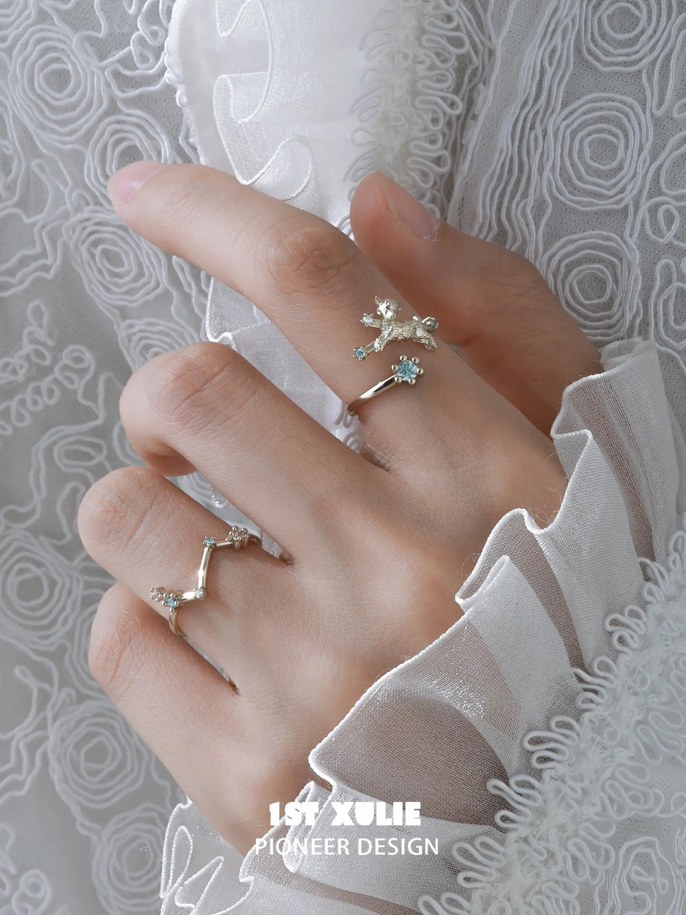 Ram and constellation open rings worn with coordinating jewelry