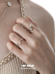 Ram and constellation open rings worn with coordinating jewelry