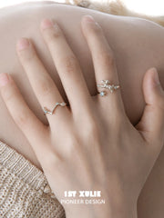 Ram and constellation open rings worn with coordinating jewelry