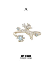 Style A ram-motif open ring with a pale blue stone