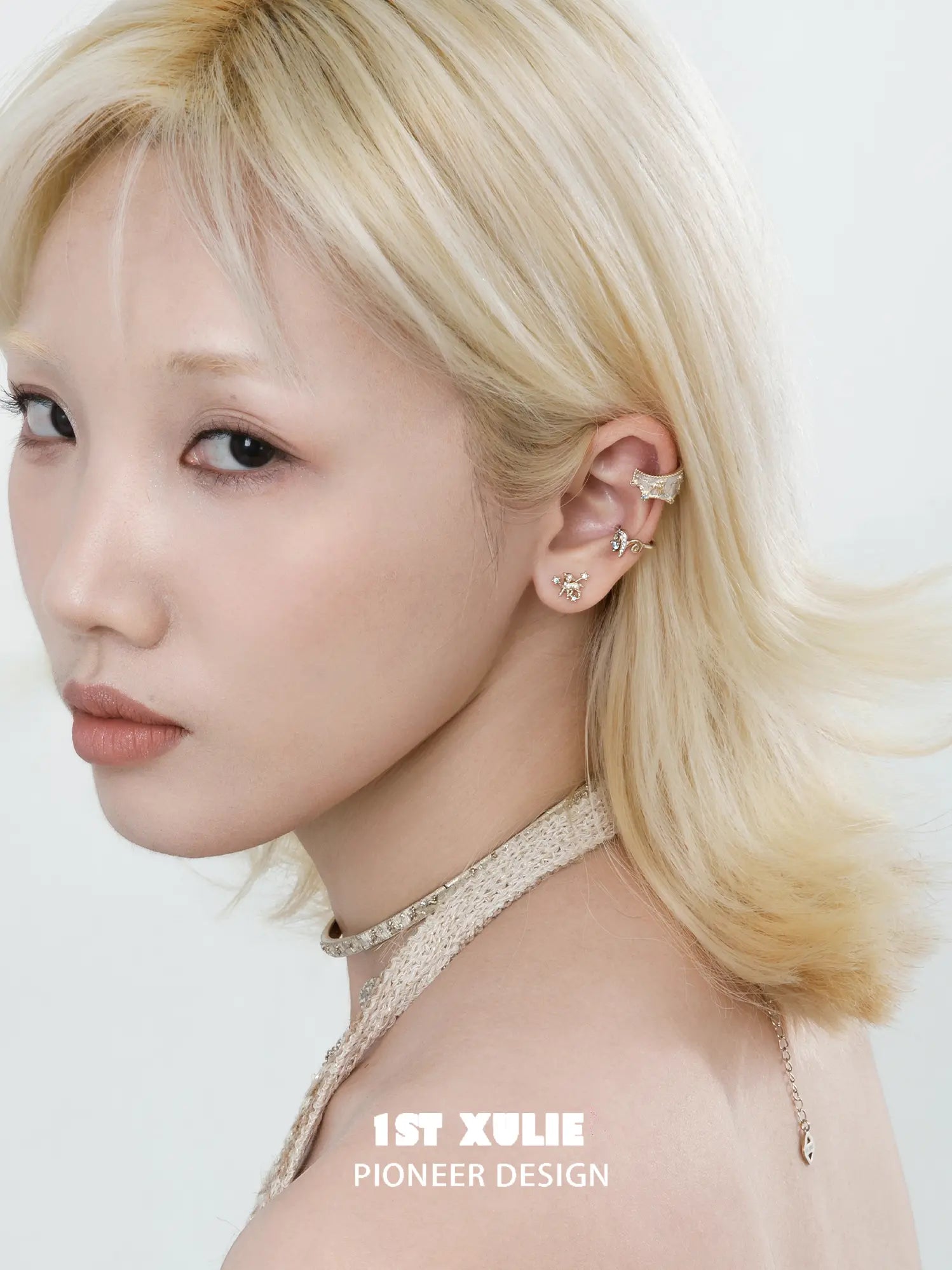 Celestial ram and star ear cuffs worn along the ear