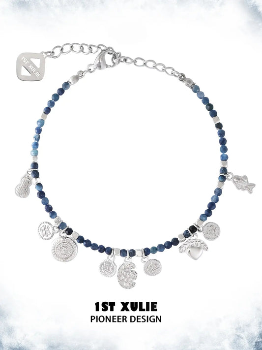 Blue beaded charm bracelet showing the ornamental details and overall silhouette