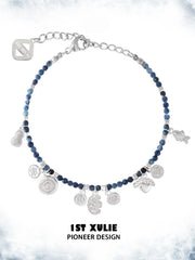 Blue beaded charm bracelet showing the ornamental details and overall silhouette
