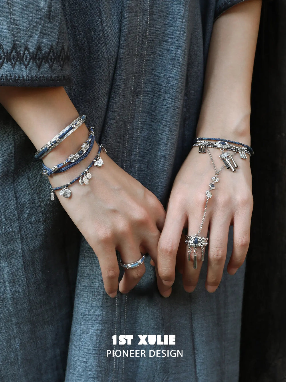 Blue braided charm bracelets worn with coordinating jewelry