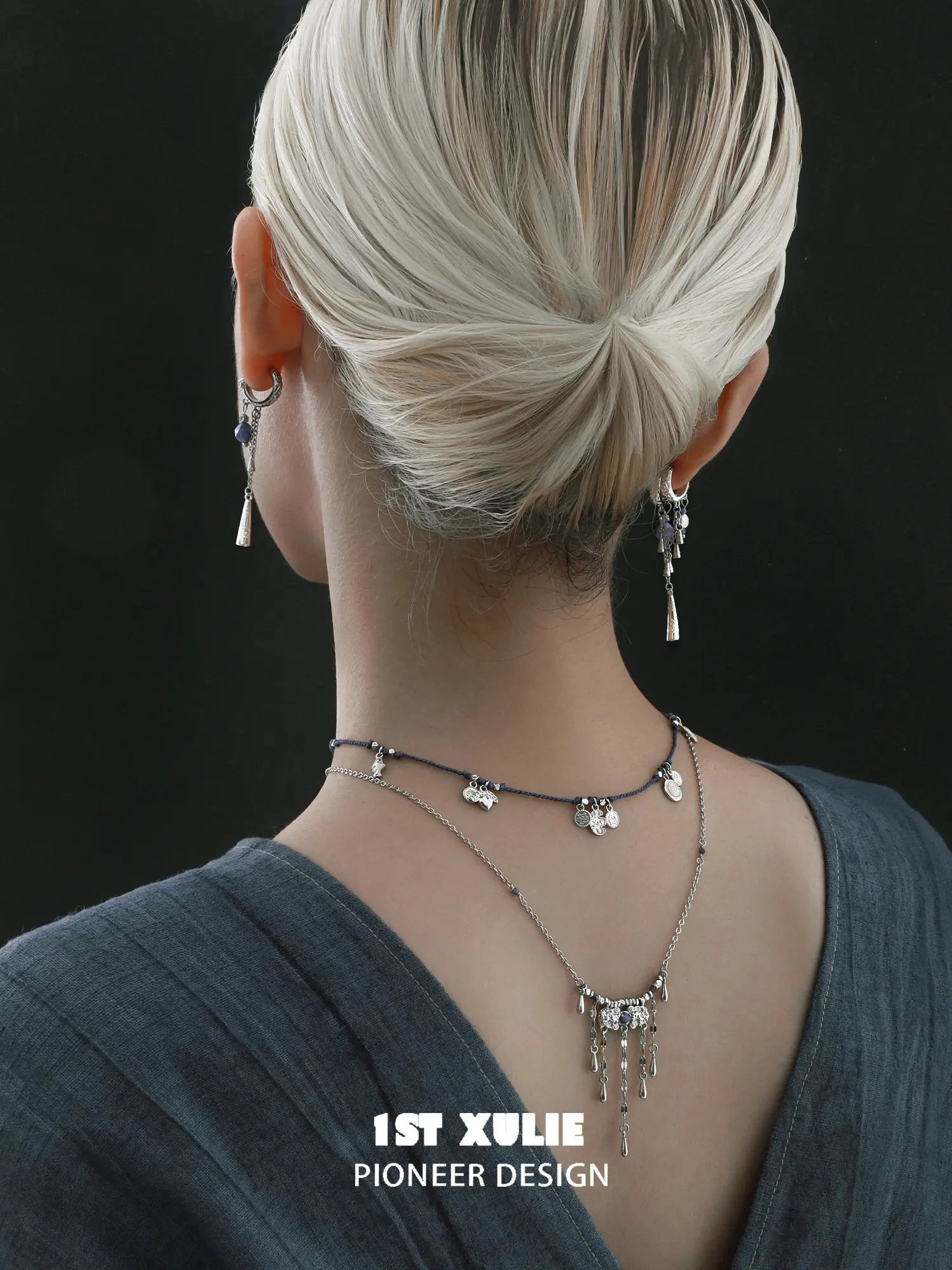 Blue cord and tassel layering necklaces layered at the neckline