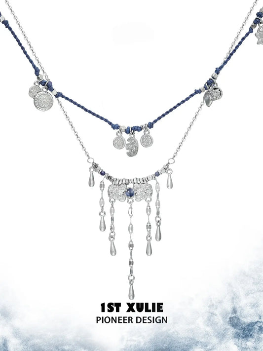 Blue cord and tassel layering necklaces showing the ornamental details and overall silhouette
