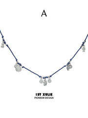 Style A blue cord necklace with round dangling charms
