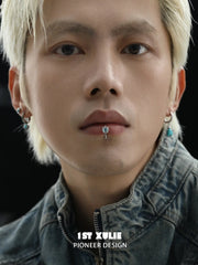 Blue eye lip cuff worn at the lower lip