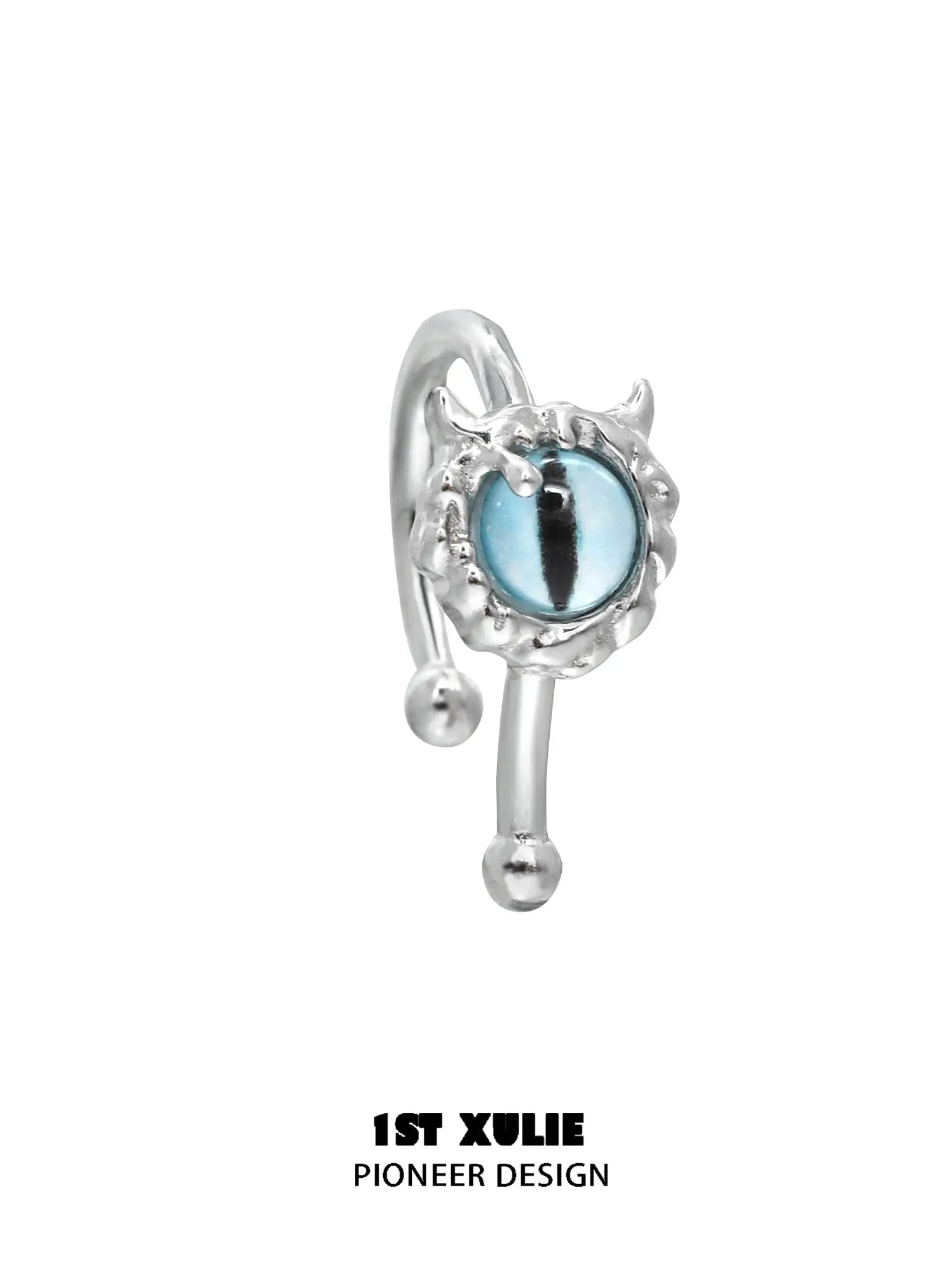 Blue eye lip cuff with a sculpted silver frame on a white background