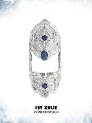 Blue stone articulated ring showing the ornamental details and overall silhouette