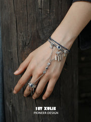 Hand chain bracelet worn across the back of the hand