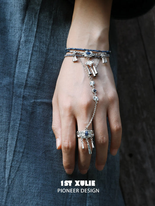 Front view showing the bracelet-to-ring chain connection