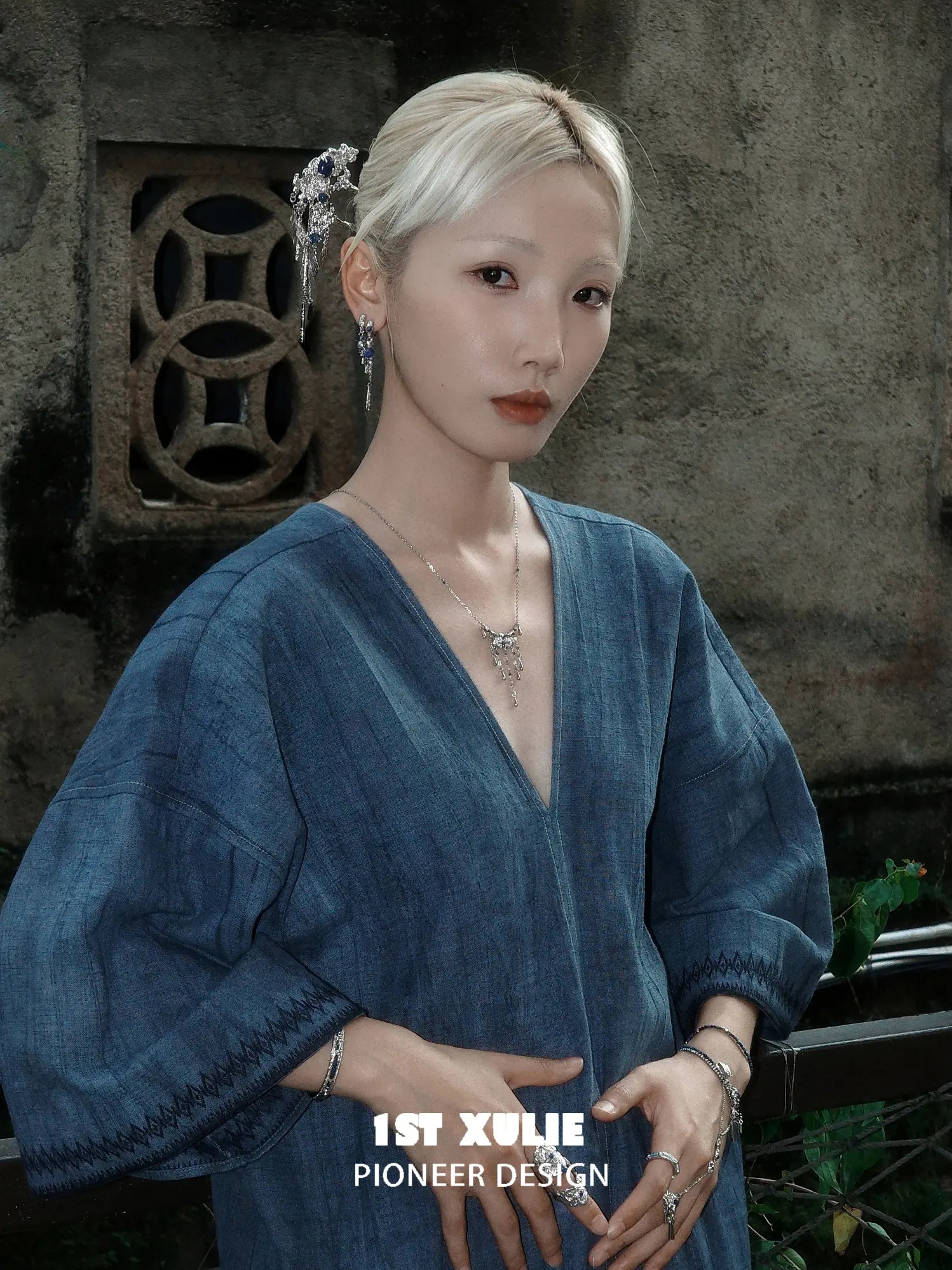 Blue stone tassel hair pin worn in a pinned hairstyle