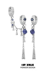 Asymmetrical blue stone tassel earrings, one with a linked double-hoop detail