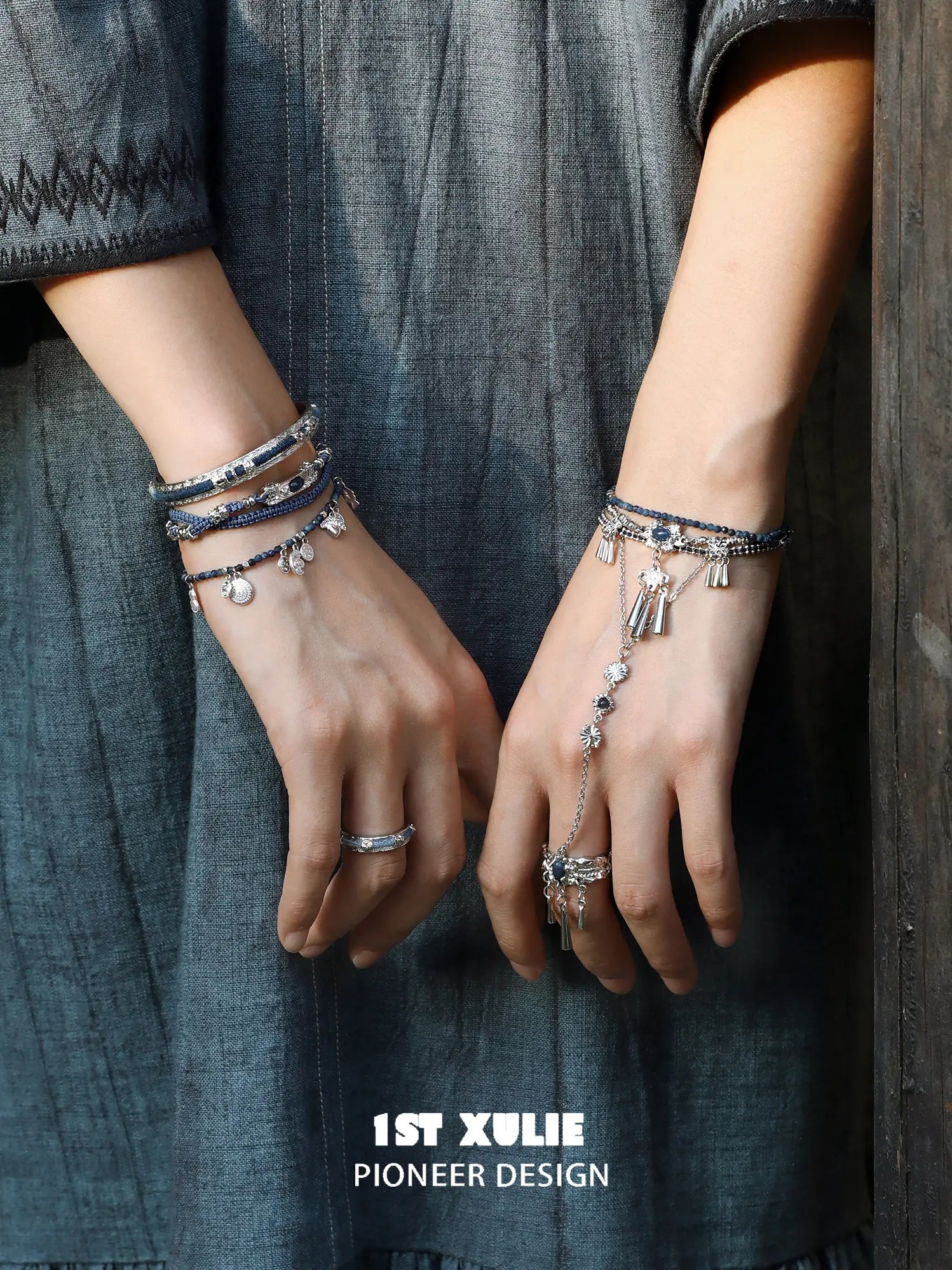 Blue woven open bangles worn with coordinating jewelry