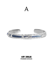 Style A blue woven open bangle without a central stone