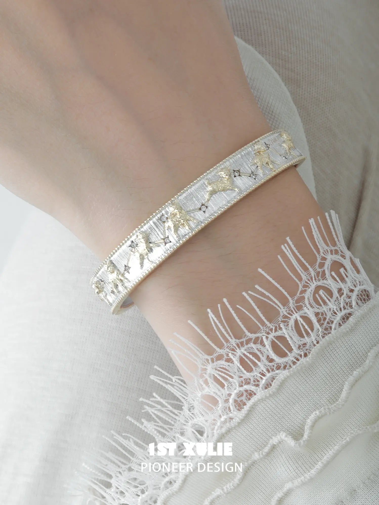 Close-up of the raised celestial decoration on the bangle