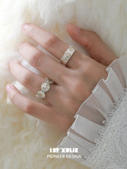 Celestial medallion and patterned band rings worn with coordinating jewelry