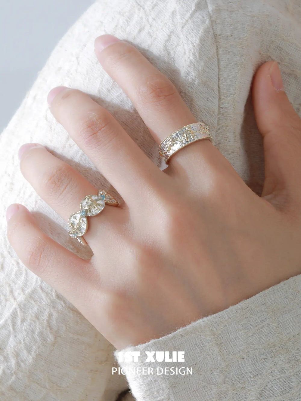 Celestial patterned open band ring worn with coordinating jewelry