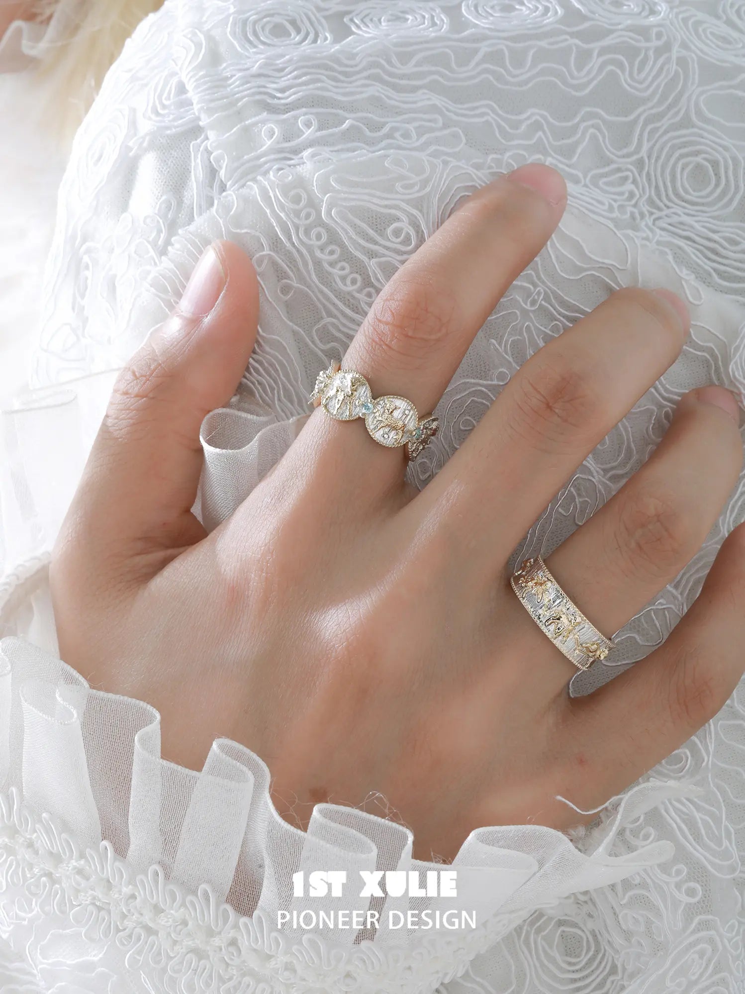 Celestial patterned open band ring worn with coordinating jewelry