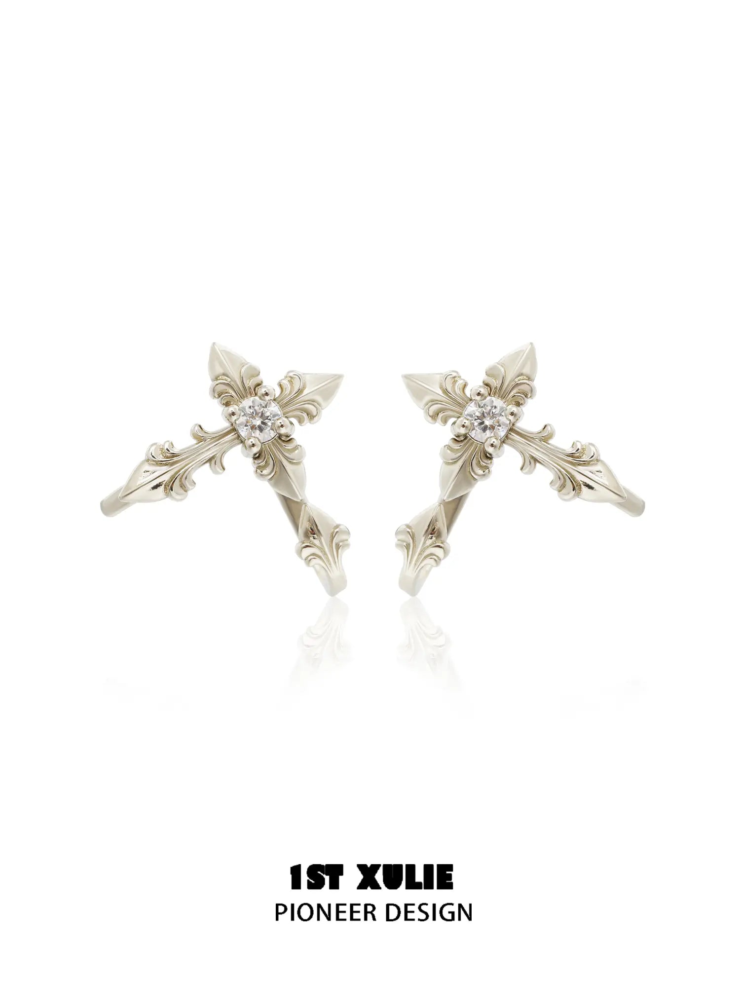 Gold-toned detachable fleur-de-lis earrings with elongated decorative sections