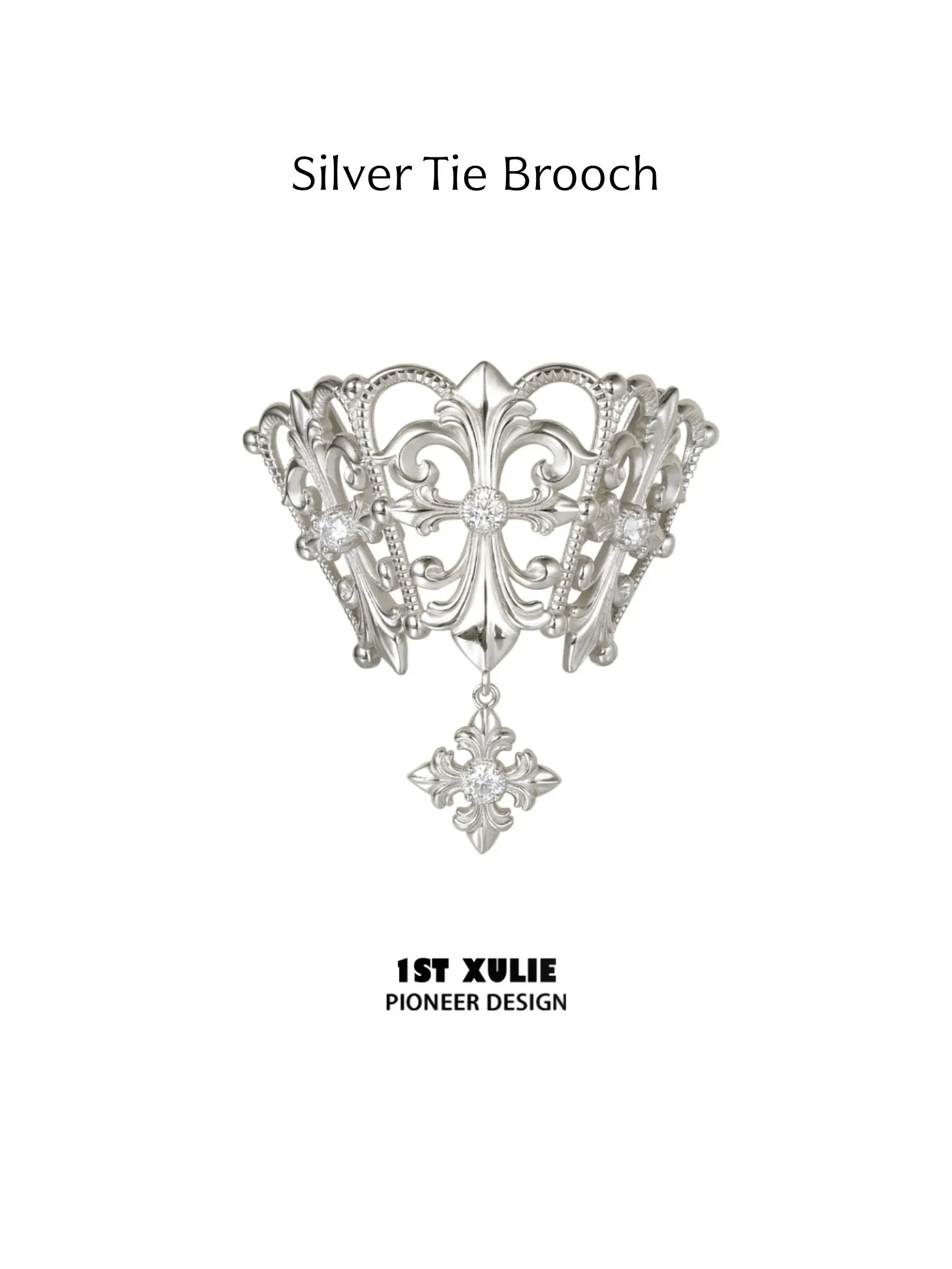Silver-toned openwork tie brooch with a clear-stone drop