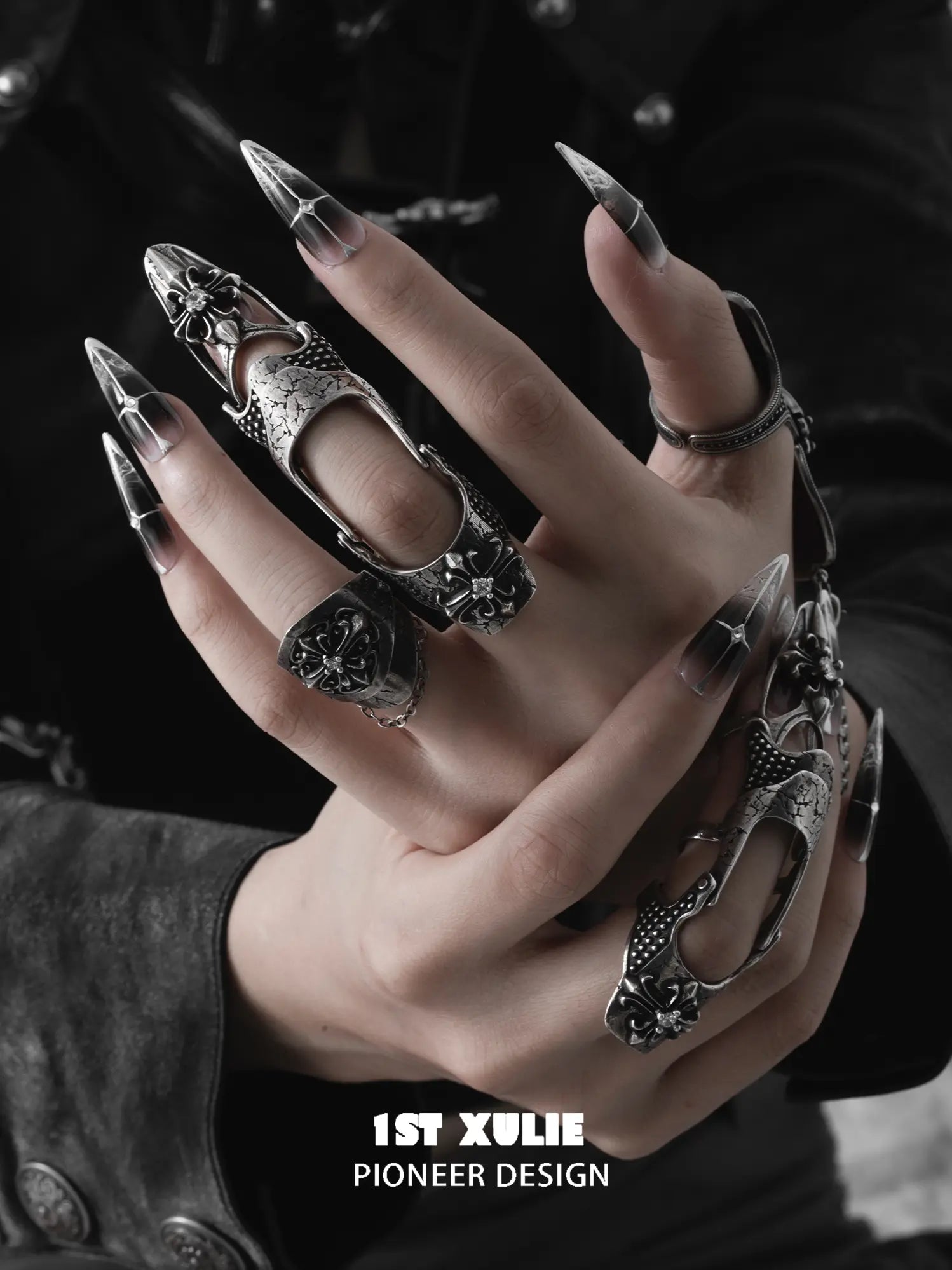 Gothic long armor and chain signet rings worn with coordinating jewelry
