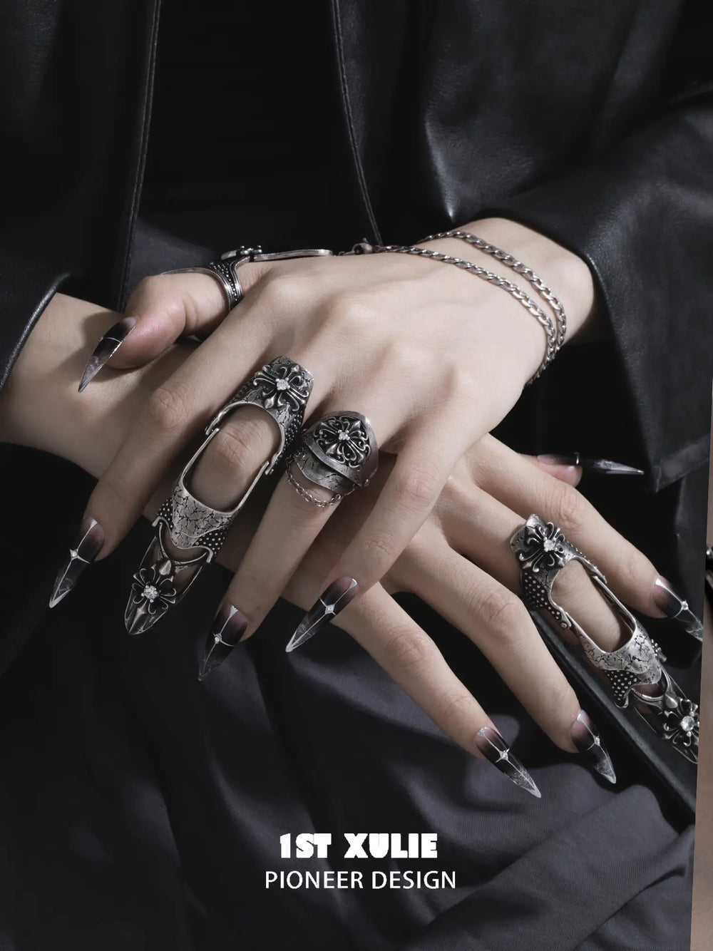 Gothic long armor and chain signet rings worn with coordinating jewelry