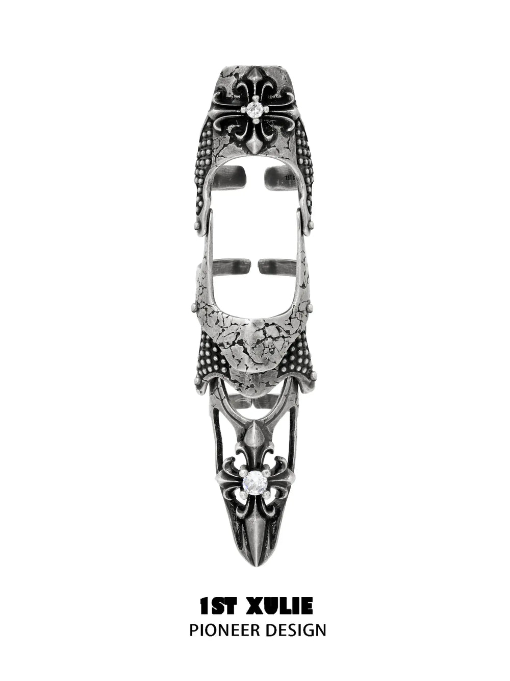 Long gothic open armor ring with raised fleur-de-lis details and pointed end