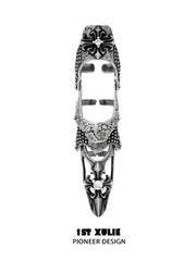 Long gothic open armor ring with raised fleur-de-lis details and pointed end