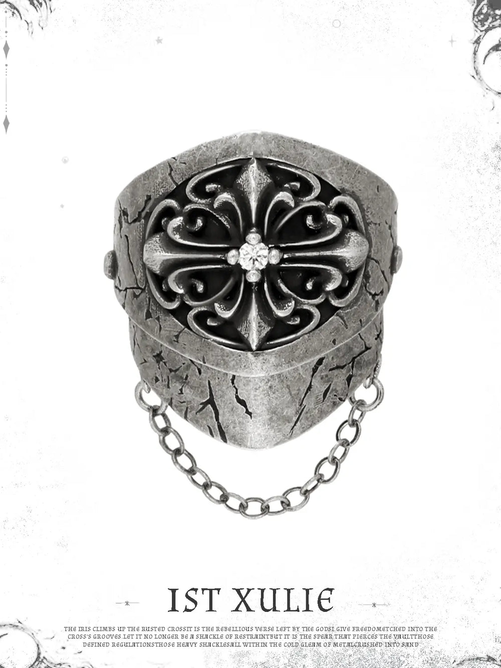 Short gothic chain signet ring against a pale decorative border